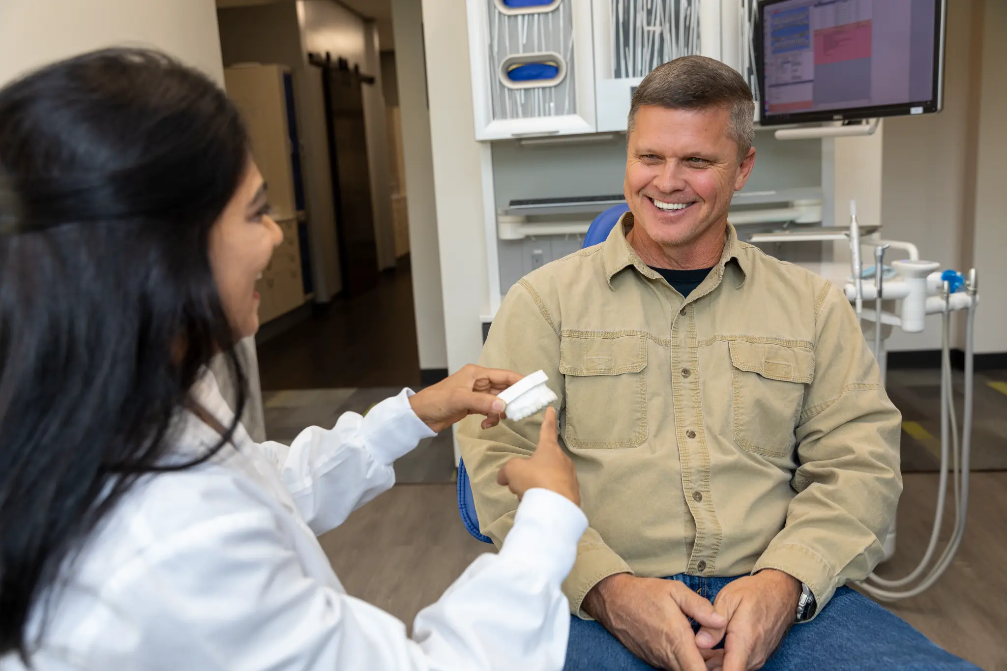 VSP Dental doctor reviewing a smile model with a patient